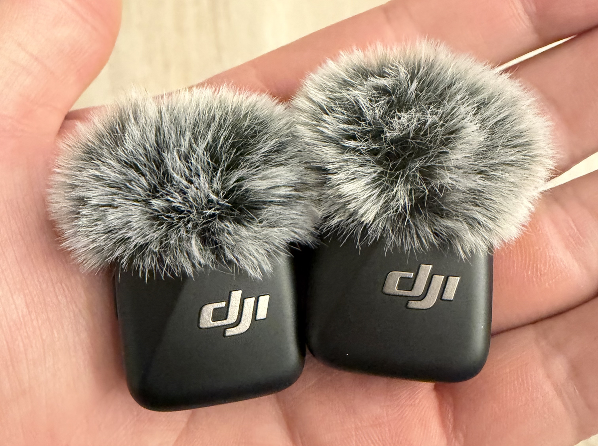 Both DJI Mic Mini transmitters with windscreens, fitting in the palm of my hand